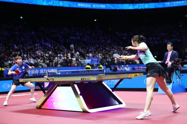 (251116) -- MACAO, Nov. 16, 2025 (Xinhua) -- Zhu Yuling (L) and Chen Meng compete during the women's singles bronze medal match of table tennis between Zhu Yuling of Macao and Chen Meng of Shandong at China's 15th National Games in Macao, south China, Nov. 16, 2025. (Xinhua/Liu Xu)