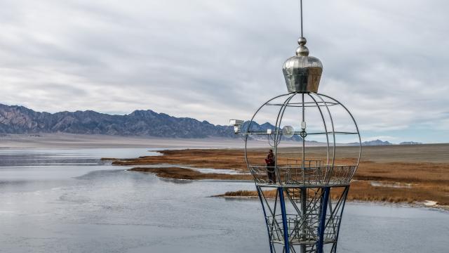 (251116) -- AKSAY, Nov. 16, 2025 (Xinhua) -- A drone photo taken on Nov. 16, 2025 shows a forest ranger monitoring the ice conditions on the lake from a lookout tower in Dasugan Lake Provincial Migratory Bird Nature Reserve in Kazak Autonomous County of Aksay, Jiuquan, northwest China's Gansu Province. Dasugan Lake and Xiaosugan Lake are connected and are both formed by the meltwater from the Qilian Mountains. A unique phenomenon is that the upstream Xiaosugan Lake is a freshwater lake, while the downstream Dasugan Lake is a saline lake. 
   Together, they nurture a vibrant ecological wetland in the vast Gobi Desert, serving as an important stopover and breeding habitat for migratory birds along China's migration routes. (Xinhua/Lang Bingbing)