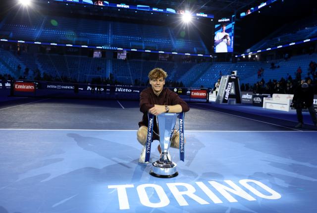 (251117) -- TURIN, Nov. 17, 2025 (Xinhua) -- Jannik Sinner poses with the trophy after winning the men's singles final match between Jannik Sinner of Italy and Carlos Alcaraz of Spain at the ATP Finals tennis tournament in Turin, Italy, on Nov. 16, 2025. (Xinhua/Li Jing)