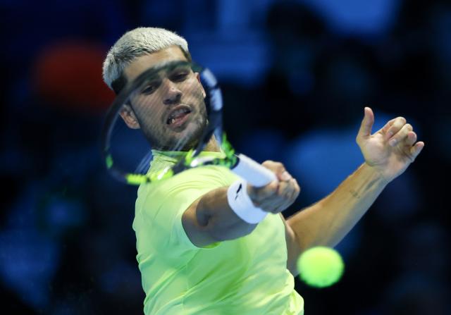 (251117) -- TURIN, Nov. 17, 2025 (Xinhua) -- Carlos Alcaraz returns a shot during the men's singles final match between Jannik Sinner of Italy and Carlos Alcaraz of Spain at the ATP Finals tennis tournament in Turin, Italy, on Nov. 16, 2025. (Xinhua/Li Jing)