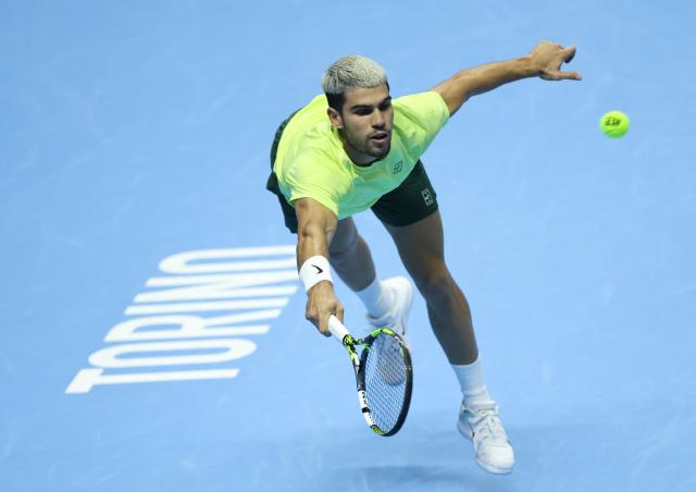 (251117) -- TURIN, Nov. 17, 2025 (Xinhua) -- Carlos Alcaraz returns a shot during the men's singles final match between Jannik Sinner of Italy and Carlos Alcaraz of Spain at the ATP Finals tennis tournament in Turin, Italy, on Nov. 16, 2025. (Xinhua/Li Jing)