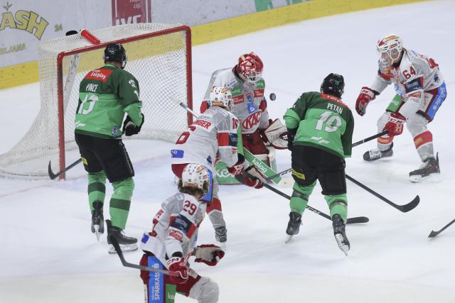 (251117) -- LJUBLJANA, Nov. 17, 2025 (Xinhua) -- Alex Petan (2nd R) of Olimpija Ljubljana shoots to score during the 2025/26 Win2day Ice Hockey League match between Olimpija Ljubljana and EC-KAC in Ljubljana, Slovenia, Nov. 16, 2025. (Photo by Zeljko Stevanic/Xinhua)