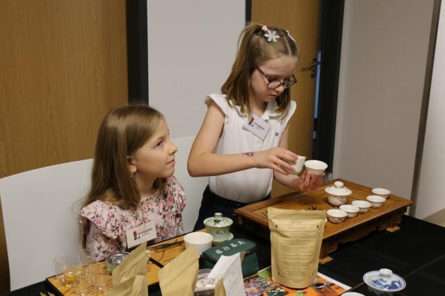 (251117) -- PRAGUE, Nov. 17, 2025 (Xinhua) -- Children try Chinese tea ceremony during the 2025 Euro Tea Expo held in Prague, the Czech Republic, Nov. 15, 2025. The 2025 Euro Tea Expo concluded on Sunday in Prague, bringing together tea experts, exhibitors and enthusiasts from around the world, with this year's focus on Chinese Pu'er tea and southwest China's Yunnan Province.
   During the two-day event, experts from China introduced the history, fermentation techniques and cultural traditions of Pu'er tea through lectures and live tastings.
   TO GO WITH "Tea expo in Prague highlights cultural exchanges with China" (Photo by Helena Kocova/Xinhua)