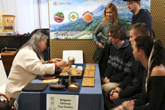 (251117) -- PRAGUE, Nov. 17, 2025 (Xinhua) -- People wait to taste Chinese tea during the 2025 Euro Tea Expo held in Prague, the Czech Republic, Nov. 15, 2025. The 2025 Euro Tea Expo concluded on Sunday in Prague, bringing together tea experts, exhibitors and enthusiasts from around the world, with this year's focus on Chinese Pu'er tea and southwest China's Yunnan Province.
   During the two-day event, experts from China introduced the history, fermentation techniques and cultural traditions of Pu'er tea through lectures and live tastings.
   TO GO WITH "Tea expo in Prague highlights cultural exchanges with China" (Photo by Helena Kocova/Xinhua)