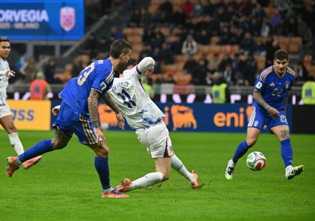 (251117) -- MILAN, Nov. 17, 2025 (Xinhua) -- Jorgen Strand Larsen (C) of Norway scores during the 2026 World Cup European Qualifiers match between Italy and Norway in Milan, Italy, Nov. 16, 2025. (Photo by Alberto Lingria/Xinhua)