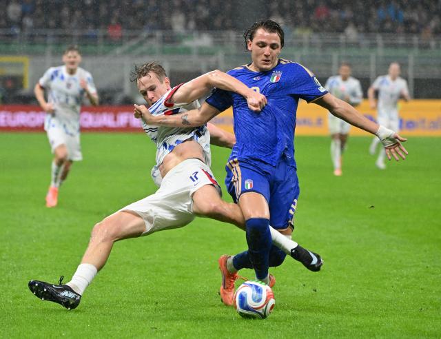 (251117) -- MILAN, Nov. 17, 2025 (Xinhua) -- Mateo Retegui (R) of Italy vies with Torbjorn Heggem of Norway during the 2026 World Cup European Qualifiers match between Italy and Norway in Milan, Italy, Nov. 16, 2025. (Photo by Alberto Lingria/Xinhua)