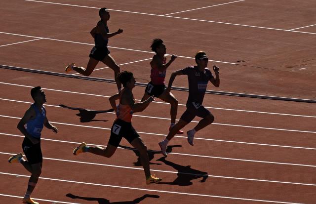(251117) -- GUANGZHOU, Nov. 17, 2025 (Xinhua) -- Ailixier Wumaier (1st R) of Xinjiang competes during the men's 400m heat of athletics in Guangzhou, south China's Guangdong Province, Nov. 17, 2025. (Xinhua/Xiao Yijiu)
