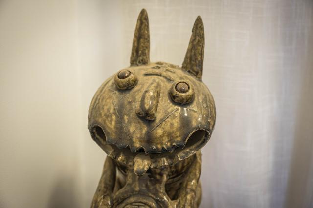 (251117) -- KUNMING, Nov. 17, 2025 (Xinhua) -- This photo taken on Nov. 7, 2025 shows Wamao displayed at the Heart Chamber Wamao Museum in Kunming, southwest China's Yunnan Province. Zhang Hang, 32, is an inheritor of the Kunming Wamao-making technique and the founder of the Heart Chamber Wamao Museum.
   Wamao, a cat-shaped pottery artifact originating in Yunnan, combines practical design with folk beliefs. Traditionally mounted on eaves or lintels, it was believed to drive away evil spirits and bring peace to the household. In 2023, Wamao was listed as one of Yunnan's provincial intangible cultural heritage items.
   Zhang first encountered Wamao in 2012, when he was studying folk art design at Yunnan Arts University. "I was drawn to its expressive artistic form," Zhang said. "I wanted to integrate its unconstrained style into modern design."
   Since then, searching for old Wamao has become part of his daily life. He has wandered through old city markets and construction sites, from cities of Dali and Lijiang to the outskirts of Kunming, chasing traces of the clay guardians.
   In 2019, Zhang founded the Wamao museum to promote the craft through exhibitions, hands-on classes, and cultural tours. Visitors can take part in Wamao-making workshops, Wamao placement ceremonies, and field trips to traditional villages.
   In his studio, Zhang mixes clay, shapes the cat's head and body, and then fires it in a kiln after drying. The belly of the cat is left hollow, with its mouth and tail connected, symbolizing the idea of "swallowing evil and releasing blessings."
   Skilled artisans can complete a Wamao in a week, but Zhang said the true challenge lies in merging tradition with innovation.
   "It sometimes takes a month to create one that feels right," he said. "The goal is to help this ancient craft find new meaning in modern society."
   As urbanization changes the landscape of Kunming, many old houses have disappeared. Zhang hopes his work will help preserve the memory of the Wamao and its cultural spirit.
   "As old houses crumble, I hope the chamber of my heart will serve as a new home for Wamao," he said. (Xinhua/Wang Guansen)