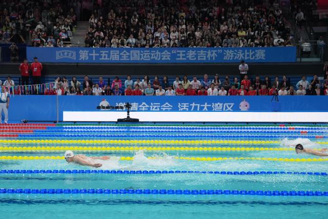 (251117) -- SHENZHEN, Nov. 17, 2025 (Xinhua) -- Sun Jiajun (L) of Hubei competes during the men's 4X100m medley relay final of swimming at China's 15th National Games in Shenzhen, south China's Guangdong Province, Nov. 17, 2025. (Xinhua/Du Yu)