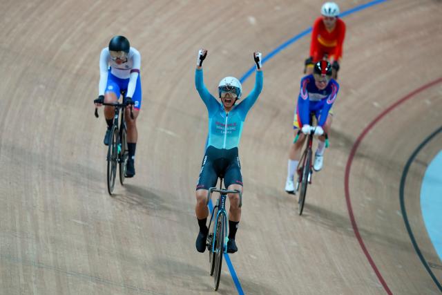 (251117) -- HONG KONG, Nov. 17, 2025 (Xinhua) -- Lee Sze Wing (front) of Hong Kong celebrates after winning the cycling track women's omnium at China's 15th National Games in Hong Kong, south China, Nov. 17, 2025. (Xinhua/Wu Lu)