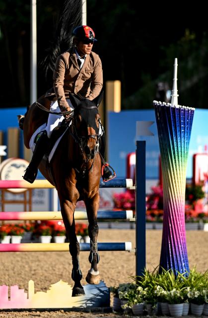 (251117) -- SHENZHEN, Nov. 17, 2025 (Xinhua) -- Darima of Inner Mongolia competes during the jumping team final of equestrian at China's 15th National Games in Shenzhen, south China's Guangdong Province, Nov. 17, 2025. (Xinhua/Feng Kaihua)