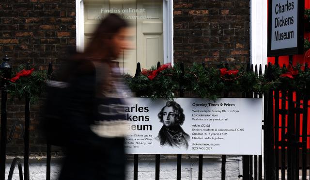 (251118) -- LONDON, Nov. 18, 2025 (Xinhua) -- A woman walks past the Charles Dickens Museum in London, Britain, on Nov. 17, 2025. The museum is situated at 48 Doughty Street, Dickens's London home from 1837-1839. While living in Doughty Street, Charles Dickens, a famous British novelist, journalist and editor, finished writing "The Pickwick Papers," wrote "Nicholas Nickleby" and most famously of all, "Oliver Twist." (Xinhua/Li Ying)