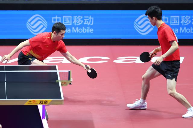 (251118) -- MACAO, Nov. 18, 2025 (Xinhua) -- Xu Xin (L)/Zhou Kai of Shanghai compete against Zhou Yu/Liang Yanning of Hebei during the men's team quarterfinal match of table tennis between Shanghai and Hebei at China's 15th National Games in Macao, south China, Nov. 18, 2025. (Xinhua/Liu Xu)