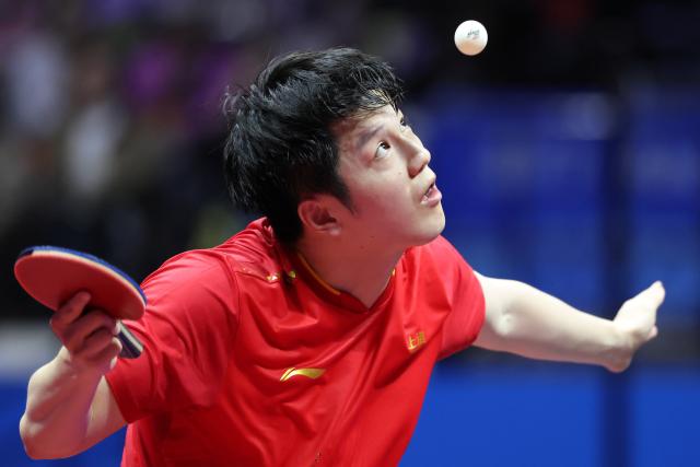 (251118) -- MACAO, Nov. 18, 2025 (Xinhua) -- Fan Zhendong of Shanghai serves in the match against Liang Jingkun of Hebei during the men's team quarterfinal match of table tennis between Shanghai and Hebei at China's 15th National Games in Macao, south China, Nov. 18, 2025. (Xinhua/Liu Xu)