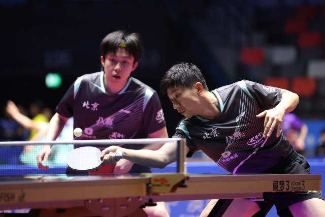 (251118) -- MACAO, Nov. 18, 2025 (Xinhua) -- Ma Long (R)/Wang Chuqin of Beijing compete against Yuan Licen/Hou Yingchao of Liaoning during the men's team quarterfinal match of table tennis between Beijing and Liaoning at China's 15th National Games in Macao, south China, Nov. 18, 2025. (Xinhua/Liang Xu)