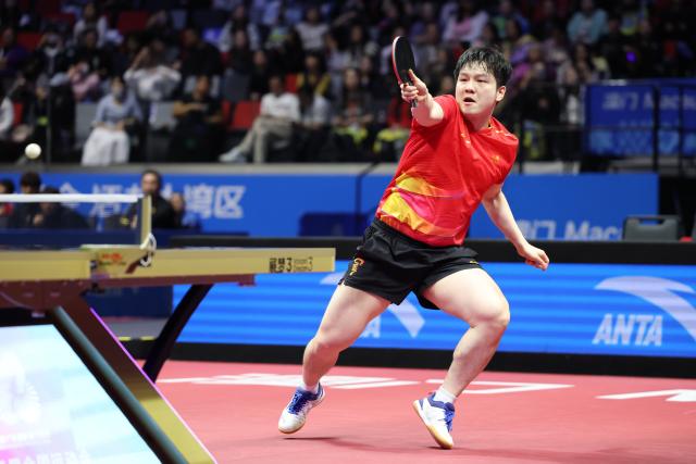 (251118) -- MACAO, Nov. 18, 2025 (Xinhua) -- Fan Zhendong of Shanghai hits a return in the match against Liang Jingkun of Hebei during the men's team quarterfinal match of table tennis between Shanghai and Hebei at China's 15th National Games in Macao, south China, Nov. 18, 2025. (Xinhua/Liang Xu)