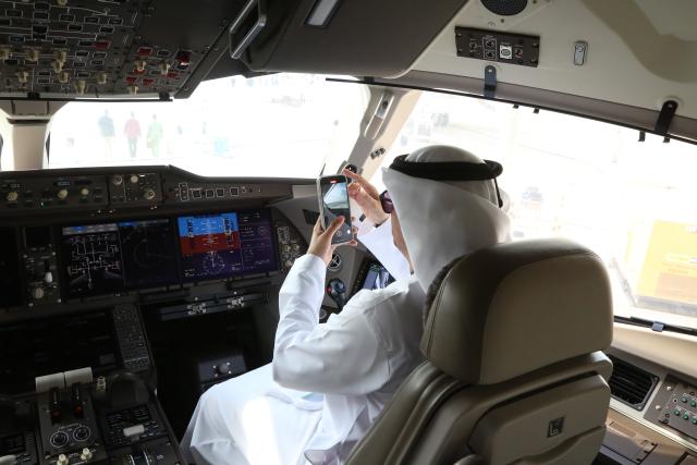 (251118) -- DUBAI, Nov. 18, 2025 (Xinhua) -- A UAE visitor sits on a C919 aircraft during the 19th edition of the Dubai Airshow in Dubai, the United Arab Emirates (UAE), Nov. 17, 2025. The 19th edition of the Dubai Airshow opened Monday at Dubai World Central, featuring the Middle East debut of two of China's homegrown C919 aircraft.
   Organizers said the five-day event, held under the theme "The Future is Here," has drawn more than 1,500 exhibitors, including 440 first-time participants. 
   The Commercial Aircraft Corporation of China (COMAC), maker of the C919, is showcasing one C919 and one C909 aircraft, while China Southern Airlines has brought another C919. The appearance of the C919 marks its first showing in the Middle East, and COMAC performed a flight demonstration of the China-made passenger plane at the venue. (Xinhua/Wen Xinnian)