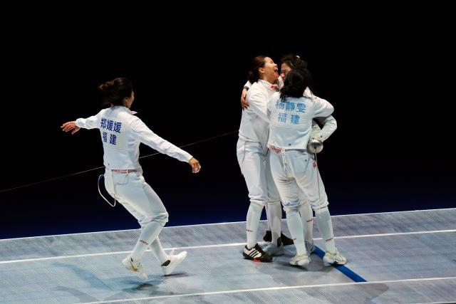 (251118) -- HONG KONG, Nov. 18, 2025 (Xinhua) -- Athletes of team Fujian celebrate after winning the women's team epee final of fencing between Fujian and Anhui at China's 15th National Games in Hong Kong, south China, Nov. 18, 2025. (Xinhua/Zhu Wei)