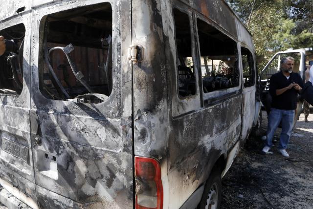(251118) -- BETHLEHEM, Nov. 18, 2025 (Xinhua) -- Palestinians inspect a burned vehicle in Al-Jaba village, West Bank city of Bethlehem, on Nov. 18, 2025. According to the official WAFA news agency, Israeli settlers on Monday evening torched several homes and vehicles in Al-Jaba village. (Photo by Mamoun Wazwaz/Xinhua)