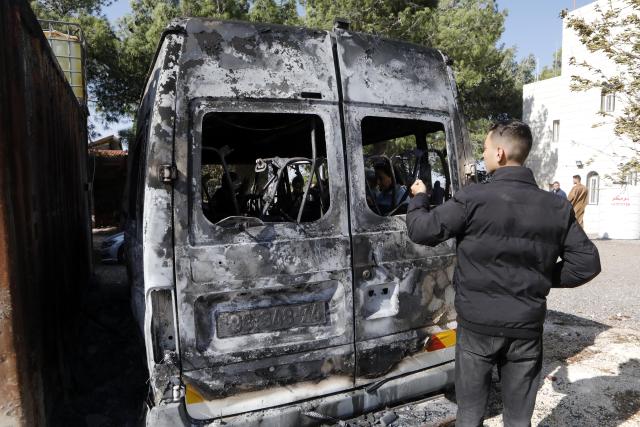 (251118) -- BETHLEHEM, Nov. 18, 2025 (Xinhua) -- Palestinians inspect a burned vehicle in Al-Jaba village, West Bank city of Bethlehem, on Nov. 18, 2025. According to the official WAFA news agency, Israeli settlers on Monday evening torched several homes and vehicles in Al-Jaba village. (Photo by Mamoun Wazwaz/Xinhua)