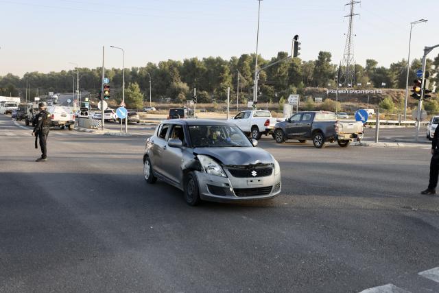 (251118) -- JERUSALEM, Nov. 18, 2025 (Xinhua) -- Security forces work at the scene of a ramming and stabbing attack at the Gush Etzion Junction, a major intersection in a settlement bloc south of Jerusalem, in the occupied West Bank, Nov. 18, 2025. An Israeli man was killed and three others wounded in a ramming and stabbing attack in the occupied West Bank on Tuesday, carried out by two Palestinian suspects who were subsequently shot dead by security forces, Israeli officials said. (Photo by Jamal Awad/Xinhua)