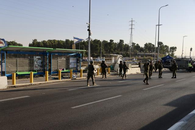 (251118) -- JERUSALEM, Nov. 18, 2025 (Xinhua) -- Security forces work at the scene of a ramming and stabbing attack at the Gush Etzion Junction, a major intersection in a settlement bloc south of Jerusalem, in the occupied West Bank, Nov. 18, 2025. An Israeli man was killed and three others wounded in a ramming and stabbing attack in the occupied West Bank on Tuesday, carried out by two Palestinian suspects who were subsequently shot dead by security forces, Israeli officials said. (Photo by Jamal Awad/Xinhua)