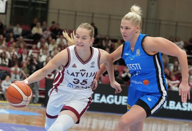 (251119) -- RIGA, Nov. 19, 2025 (Xinhua) -- Latvia's Kate Vilka (L) vies with Estonia's Greeta Uprus during the FIBA Women's EuroBasket 2027 Qualifiers match between Latvia and Estonia in Riga, Latvia. Nov. 18, 2025. (Photo by Edijs Palens/Xinhua)