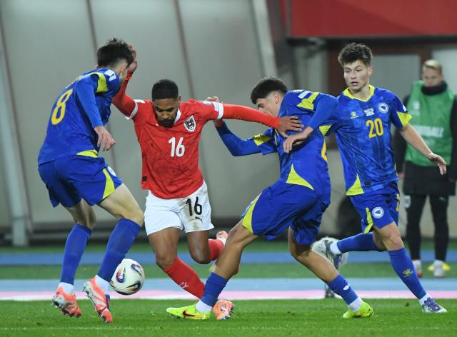 (251119) -- VIENNA, Nov. 19, 2025 (Xinhua) -- Phillipp Mwene (2nd L) of Austria competes during the 2026 World Cup European Qualifiers match between Austria VS Bosnia and Herzegovina in Vienna, Austria, Nov. 18, 2025. (Xinhua/He Canling)