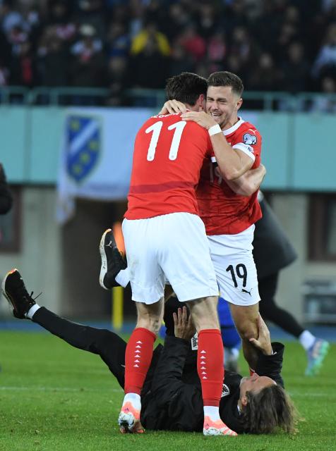 (251119) -- VIENNA, Nov. 19, 2025 (Xinhua) -- Christoph Baumgartner (R) and Michael Gregoritsch (L) of Austria celebrate victory after the 2026 World Cup European Qualifiers match between Austria VS Bosnia and Herzegovina in Vienna, Austria, Nov. 18, 2025. (Xinhua/He Canling)