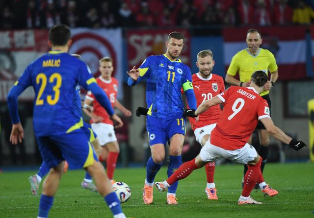 (251119) -- VIENNA, Nov. 19, 2025 (Xinhua) -- Edin Dzeko (C) of Bosnia and Herzegovina competes during the 2026 World Cup European Qualifiers match between Austria VS Bosnia and Herzegovina in Vienna, Austria, Nov. 18, 2025. (Xinhua/He Canling)