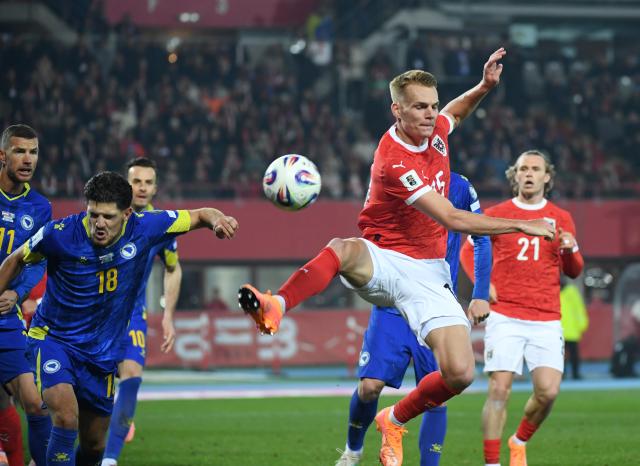 (251119) -- VIENNA, Nov. 19, 2025 (Xinhua) -- Philipp Lienhart (front, R) of Austria competes during the 2026 World Cup European Qualifiers match between Austria VS Bosnia and Herzegovina in Vienna, Austria, Nov. 18, 2025. (Xinhua/He Canling)