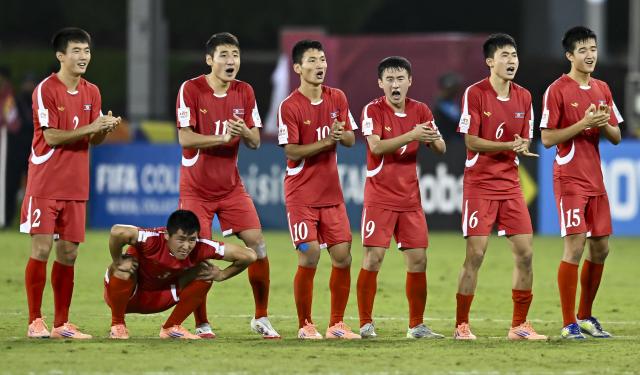 (251119) -- DOHA, Nov. 19, 2025 (Xinhua) -- Players of DPRK react during the round of 16 football match between the Democratic People's Republic of Korea (DPRK) and Japan at FIFA U17 World cup Qatar 2025 in Doha, Qatar, on Nov. 18, 2025. (Photo by Nikku/Xinhua)