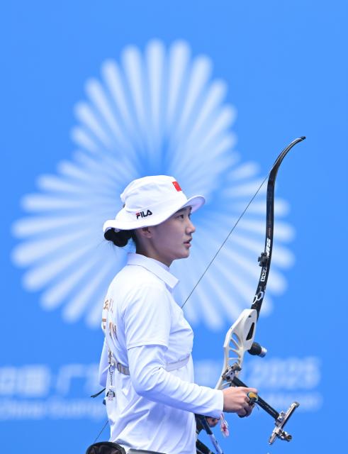 (251119) -- SHENZHEN, Nov. 19, 2025 (Xinhua) -- Bao Yijing of Henan reacts during the women's recurve team final of archery at China's 15th National Games in Shenzhen, south China's Guangdong Province, Nov. 19, 2025. (Xinhua/Zhang Long)