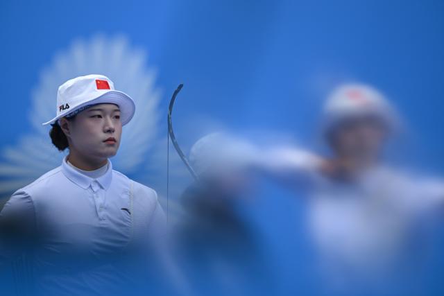(251119) -- SHENZHEN, Nov. 19, 2025 (Xinhua) -- Li Jingwei of Fujian is seen during the women's recurve team bronze medal match of archery at China's 15th National Games in Shenzhen, south China's Guangdong Province, Nov. 19, 2025. (Xinhua/Zhang Long)