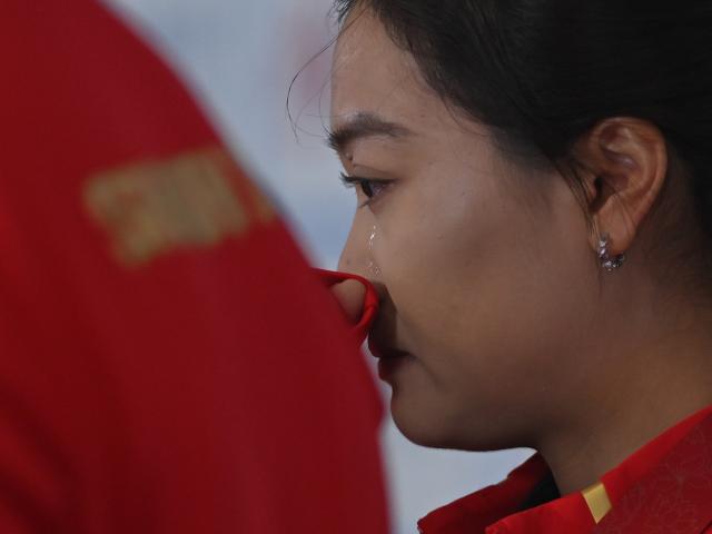(251119) -- SHENZHEN, Nov. 19, 2025 (Xinhua) -- Ru Qingning of Shaanxi reacts after the women's recurve team bronze medal match of archery at China's 15th National Games in Shenzhen, south China's Guangdong Province, Nov. 19, 2025. (Xinhua/Zhang Long)