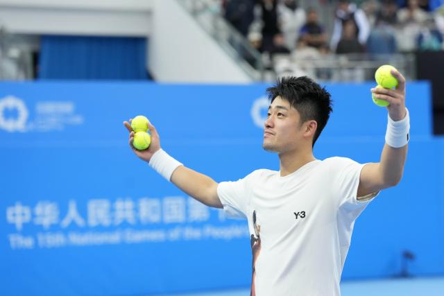 (251119) -- HENGQIN, Nov. 19, 2025 (Xinhua) -- Wu Yibing reacts after winning the men's singles semifinal match of tennis between Wu Yibing of Zhejiang and Coleman Wong Chak Lam of Hong Kong at China's 15th National Games in Hengqin, south China's Guangdong Province, Nov. 19, 2025. (Xinhua/Yan Linyun)