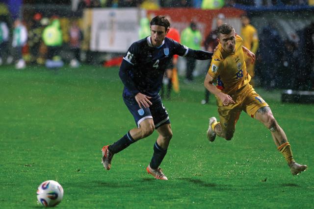 (251119) -- PLOIESTI, Nov. 19, 2025 (Xinhua) -- Romania's Florin Tanase (R) vies with San Marino's Filippo Fabbri during the 2026 World Cup European Qualifiers football match between Romania and San Marino in Ploiesti, Romania, Nov. 18, 2025. (Photo by Cristian Cristel/Xinhua)
