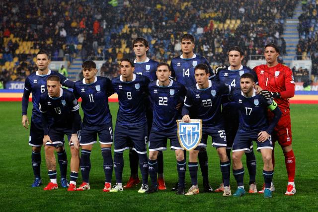 (251119) -- PLOIESTI, Nov. 19, 2025 (Xinhua) -- Players of San Marino pose for a group photo before the 2026 World Cup European Qualifiers football match between Romania and San Marino in Ploiesti, Romania, Nov. 18, 2025. (Photo by Cristian Cristel/Xinhua)