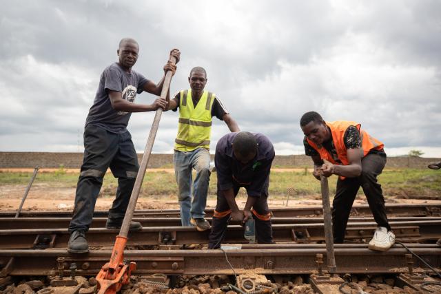 (251119) -- LUSAKA, Nov. 19, 2025 (Xinhua) -- Workers of Tanzania-Zambia Railway (TAZARA) replace the sleepers at New Kapiri Mposhi Railway Station in Central Province, Zambia, Nov. 14, 2025. TO GO WITH "Feature: Tazara Railway enters new chapter of China-Africa friendship" (Xinhua/Peng Lijun)