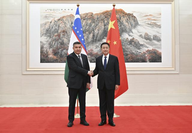 (251119) -- BEIJING, Nov. 19, 2025 (Xinhua) -- Chinese State Councilor and Minister of Public Security Wang Xiaohong meets with Uzbekistan's Minister of Internal Affairs Aziz Tashpulatov in Beijing, capital of China, Nov. 19, 2025. (Xinhua/Dai Tianfang)