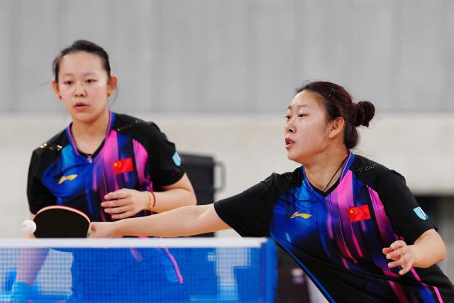 (251119) -- TOKYO, Nov. 19, 2025 (Xinhua) -- Wang Zhe/Wang Yutong (R) compete during the women's doubles final of table tennis between Shi Ce/Sun Boyao of China and Wang Zhe/Wang Yutong of China at the 25th Summer Deaflympics Tokyo 2025 in Tokyo, Japan, Nov. 19, 2025. (Xinhua/Jia Haocheng)