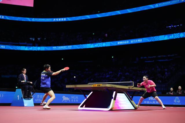 (251119) -- MACAO, Nov. 19, 2025 (Xinhua) -- Fan Siqi (L) hits a return during the table tennis fifth match of women's team final between Fan Siqi of Shandong and He Zhuojia of Hebei at China's 15th National Games in Macao, south China, Nov. 19, 2025. (Xinhua/Liu Xu)