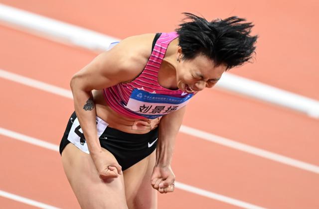 (251119) -- GUANGZHOU, Nov. 19, 2025 (Xinhua) -- Liu Jingyang of Guangdong celebrates after winning the women's 100m hurdles final of athletics at China's 15th National Games in Guangzhou, south China's Guangdong Province, Nov. 19, 2025. (Xinhua/Deng Hua)