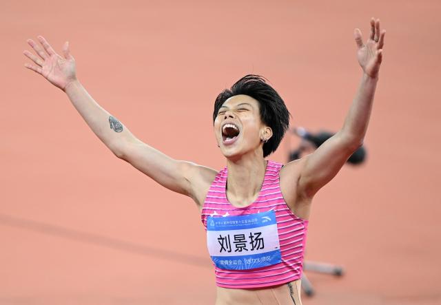 (251119) -- GUANGZHOU, Nov. 19, 2025 (Xinhua) -- Liu Jingyang of Guangdong celebrates after winning the women's 100m hurdles final of athletics at China's 15th National Games in Guangzhou, south China's Guangdong Province, Nov. 19, 2025. (Xinhua/Deng Hua)