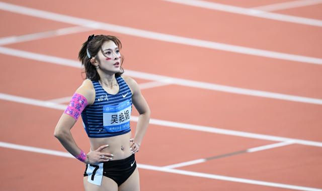 (251119) -- GUANGZHOU, Nov. 19, 2025 (Xinhua) -- Wu Yanni of Sichuan looks on after the women's 100m hurdles final of athletics at China's 15th National Games in Guangzhou, south China's Guangdong Province, Nov. 19, 2025. (Xinhua/Deng Hua)