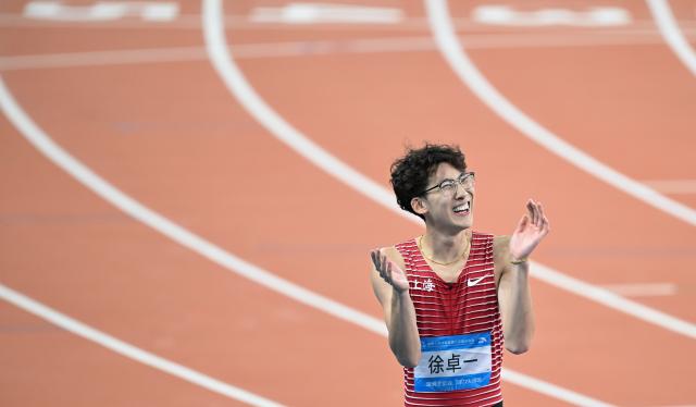 (251119) -- GUANGZHOU, Nov. 19, 2025 (Xinhua) -- Xu Zhuoyi of Shanghai celebrates after the men's 110m hurdles final of athletics at China's 15th National Games in Guangzhou, south China's Guangdong Province, Nov. 19, 2025. (Xinhua/Deng Hua)