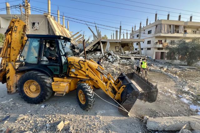 (251120) -- DEIR KIFA, Nov. 20, 2025 (Xinhua) -- A bulldozer works in front of the ruins of a destroyed building in Deir Kifa, southern Lebanon, Nov. 19, 2025. (Photo by Ali Hashisho/Xinhua)