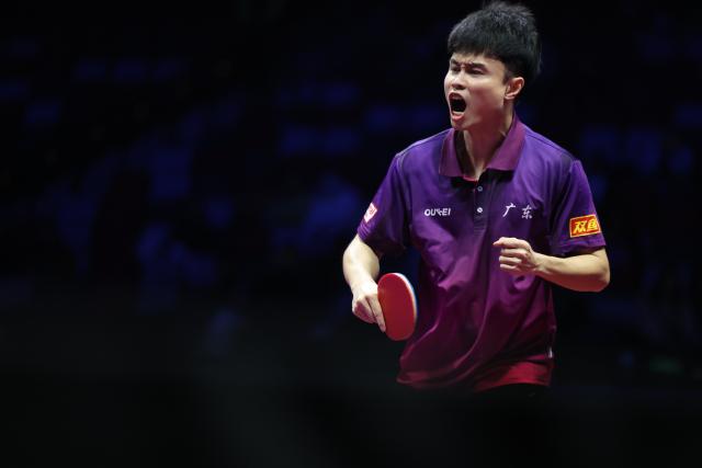 (251120) -- MACAO, Nov. 20, 2025 (Xinhua) -- Zhou Qihao of Guangdong celebrates scoring in the match against Wei Shihao of Heilongjiang during the men's team bronze medal match of table tennis between Guangdong and Heilongjiang at China's 15th National Games in Macao, south China, Nov. 20, 2025. (Xinhua/Chen Bin)
