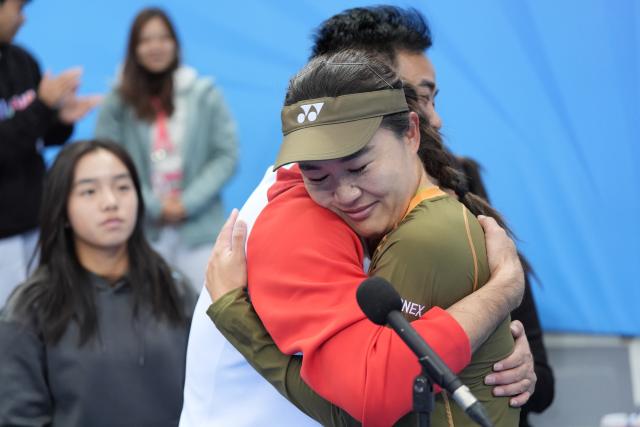 (251120) -- HENGQIN, Nov. 20, 2025 (Xinhua) -- Zhu Lin (front R) reacts after the women's singles final of tennis between Zhu Lin of Anhui and Gao Xinyu of Beijing at China's 15th National Games in Hengqin, south China's Guangdong Province, Nov. 20, 2025. (Xinhua/Yan Linyun)
