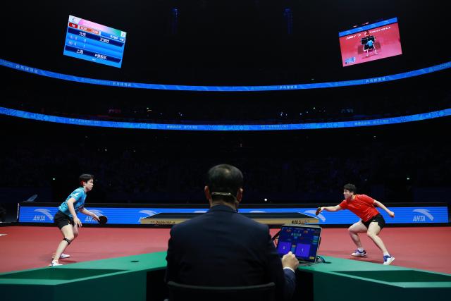 (251120) -- MACAO, Nov. 20, 2025 (Xinhua) -- Fan Zhendong (R) of Shanghai hits a return in the match against Wang Chuqin of Beijing during the men's team final of table tennis between Beijing and Shanghai at China's 15th National Games in Macao, south China, Nov. 20, 2025. (Xinhua/Liang Xu)
